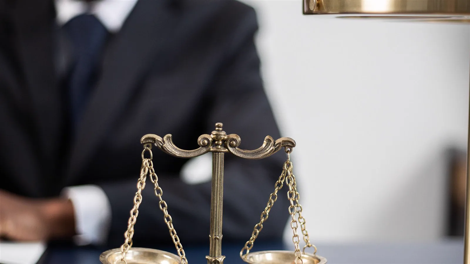 Brass balance scale on a desk symbolizing weighing trade-offs
